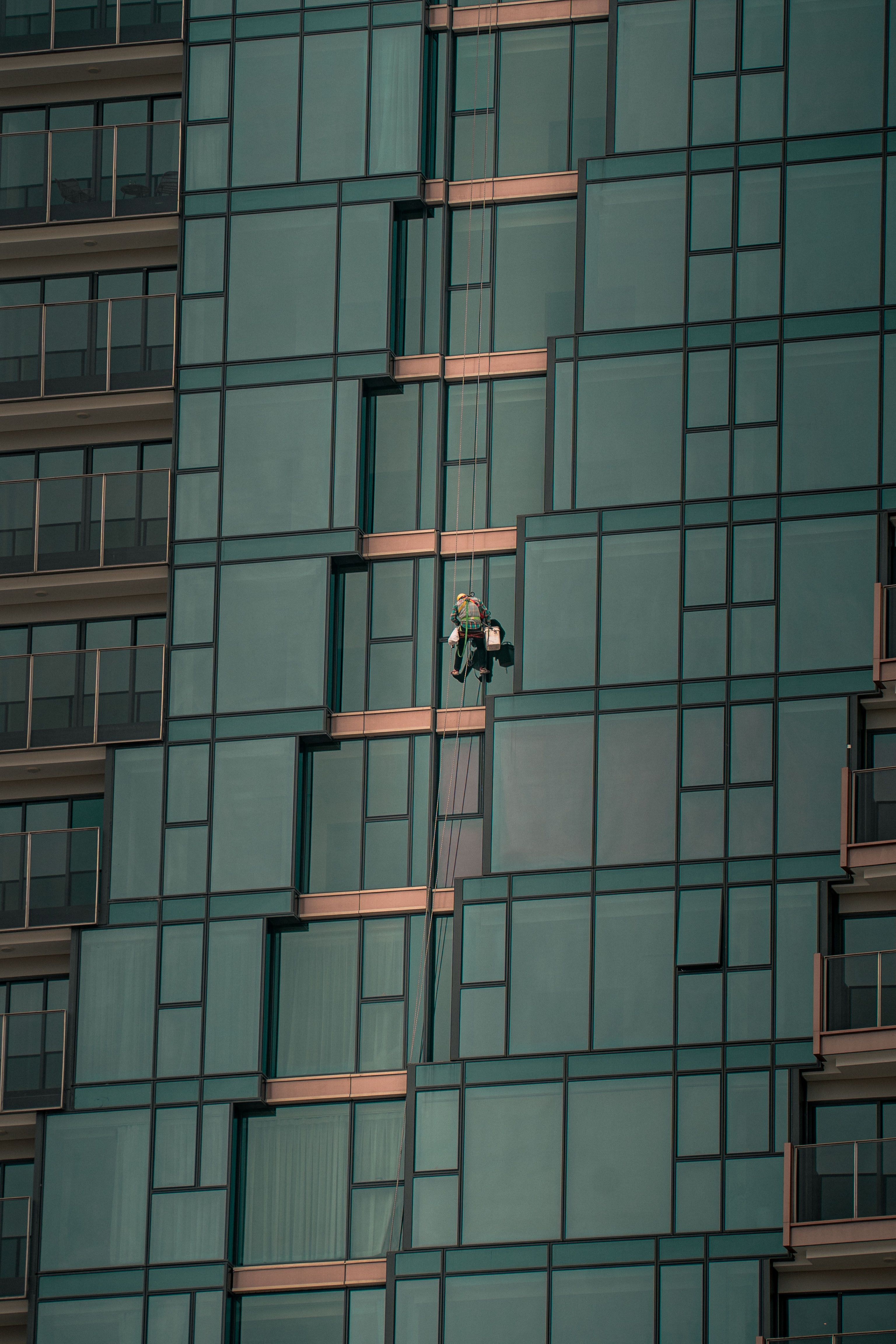 Window cleaner on a modern skyscraper in Hồ Chí Minh City, Vietnam.