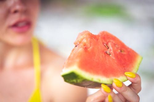 Woman Holding Sliced Watermelon