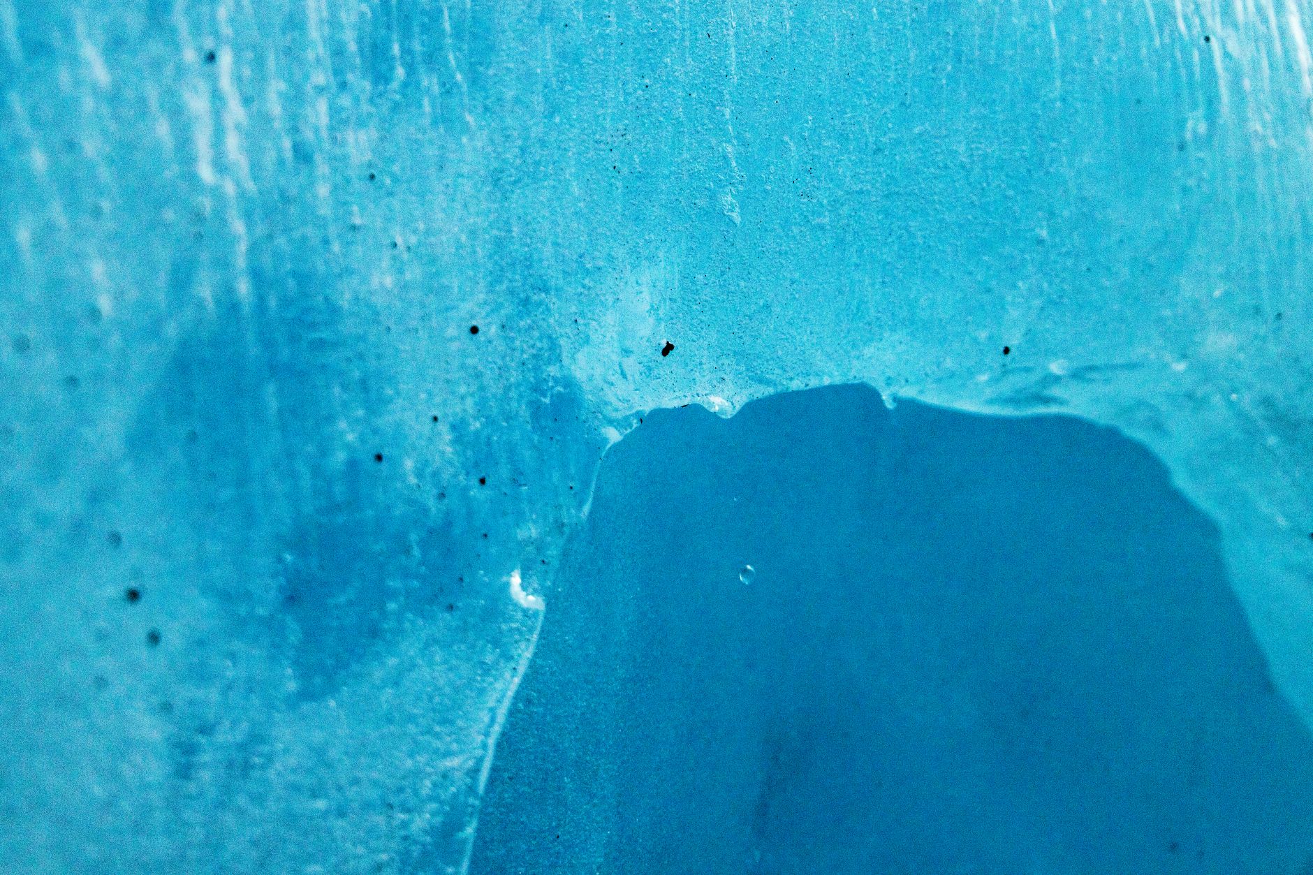Detailed shot of a beautiful blue ice formation showcasing natural textures.. detailed, shot, beautiful