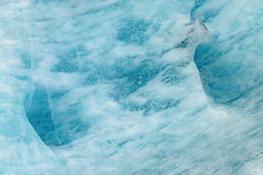 Stunning aerial shot of a glacier's icy blue texture, capturing the serene wilderness.. stunning, aerial, shot