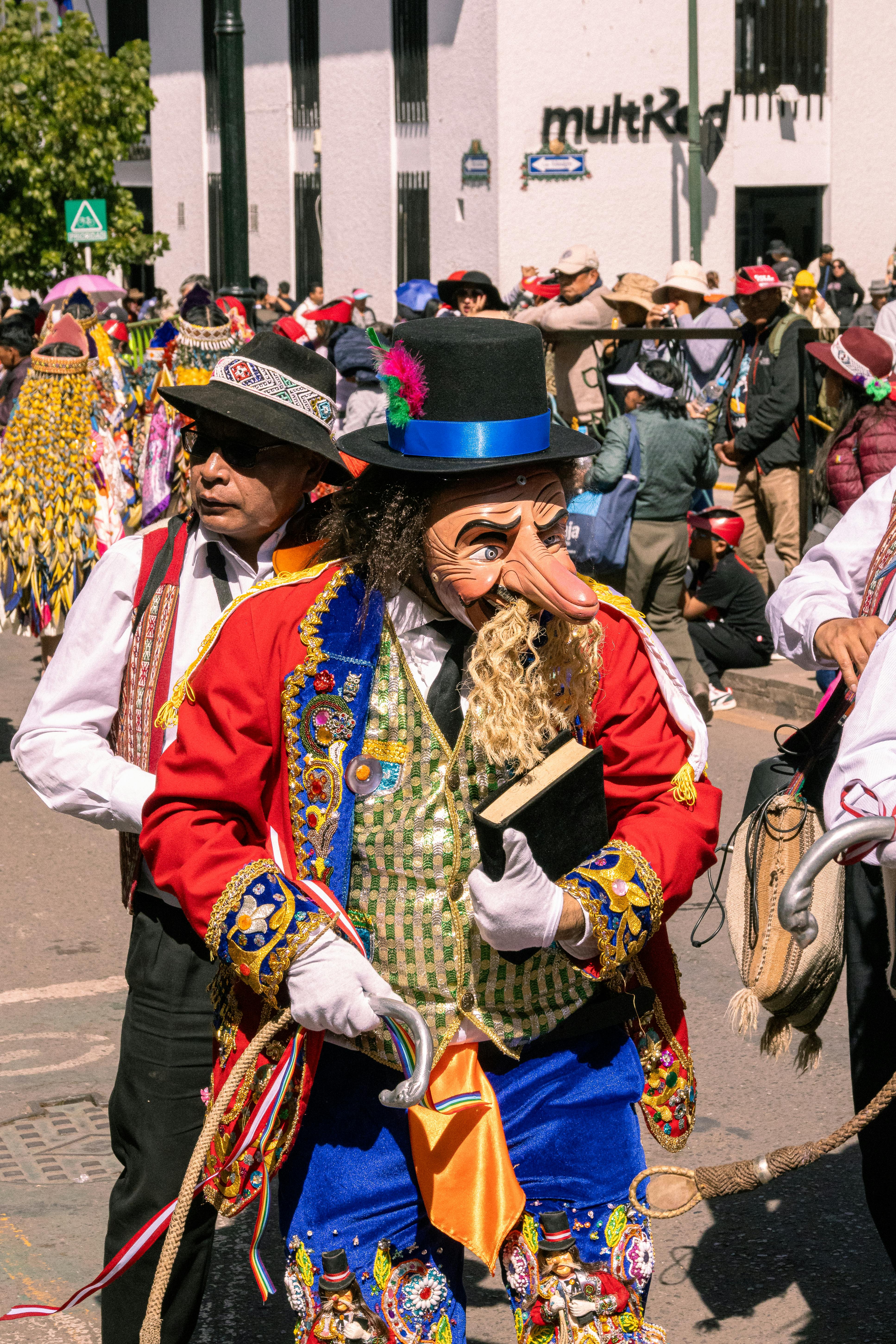 A man dressed in costume with a hat and a long beard