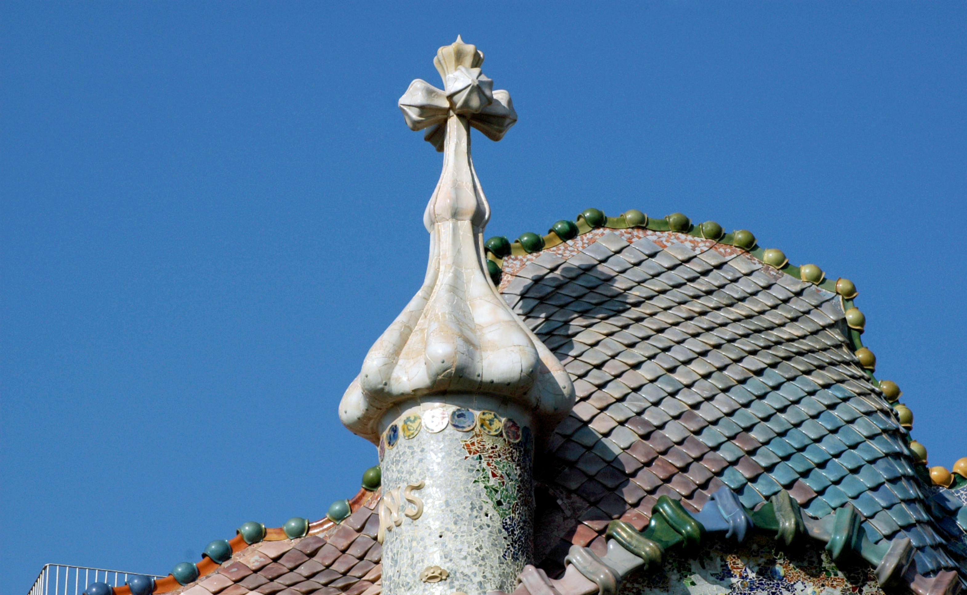 the roof of a building with colorful tiles