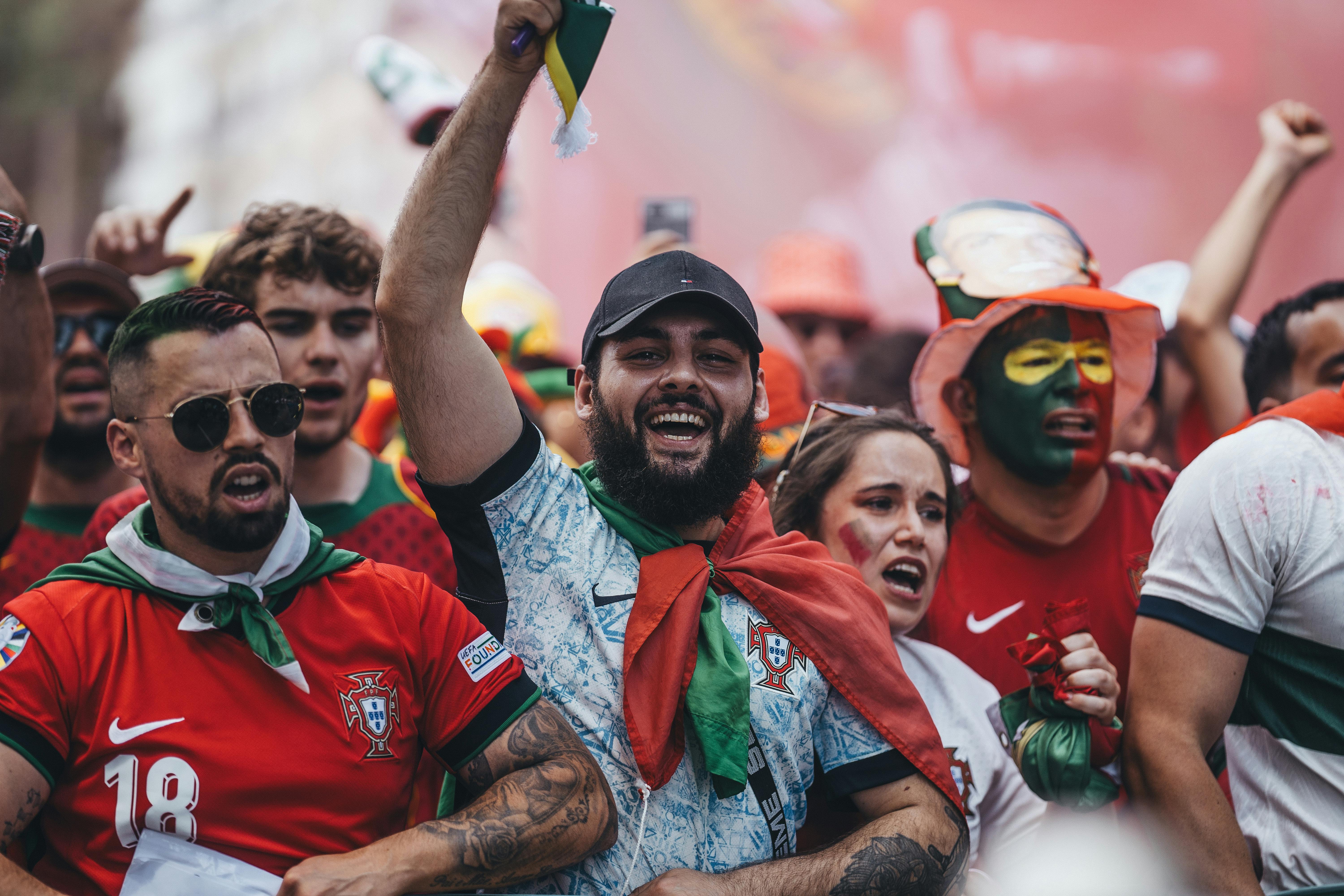 portugal fans celebrate their team s victory in the world cup