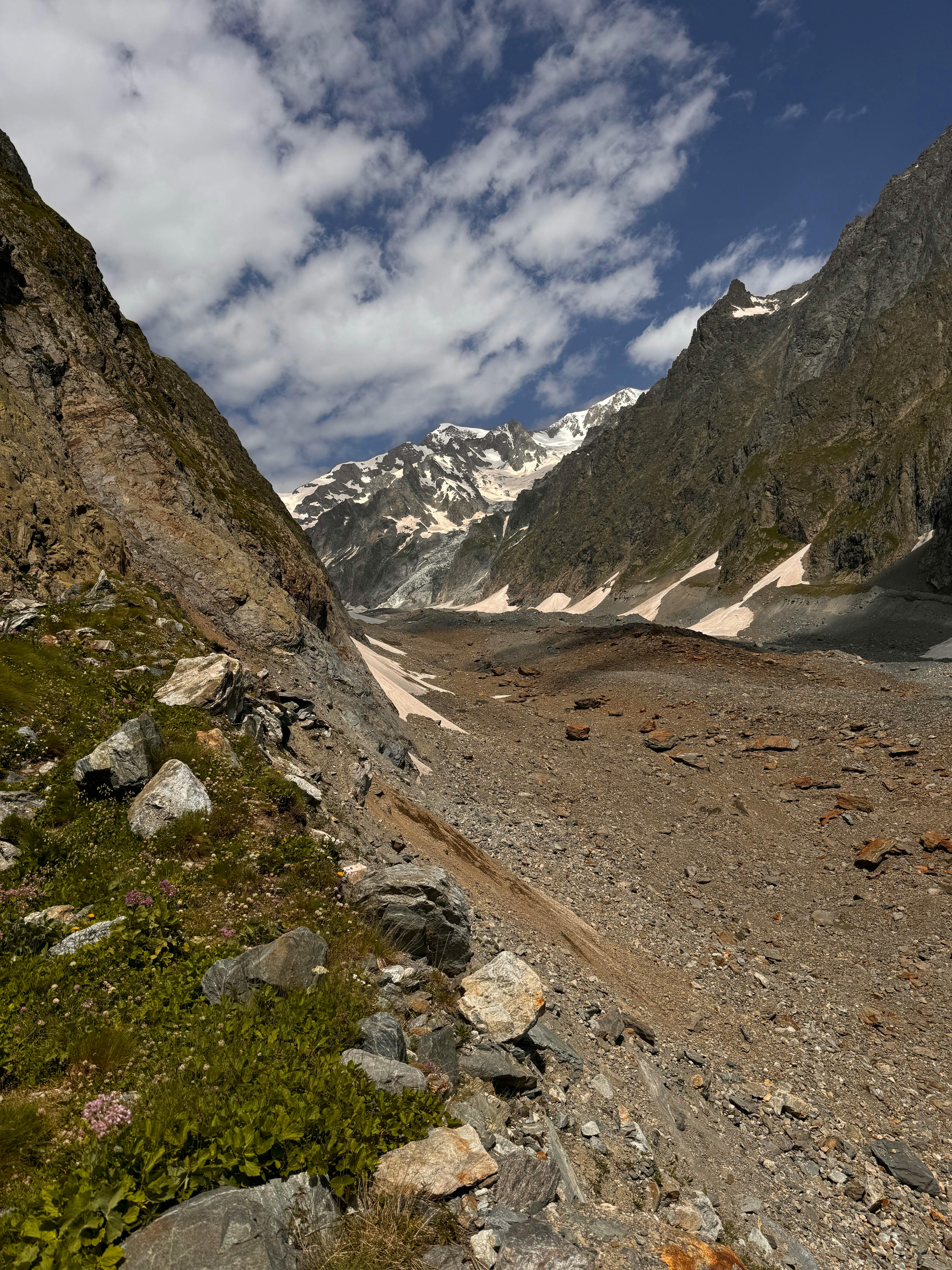 a rocky mountain with a river running through it