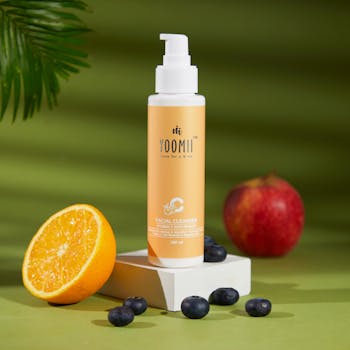 Facial cleanser with natural ingredients like orange, apple, and blueberries for healthy skin.