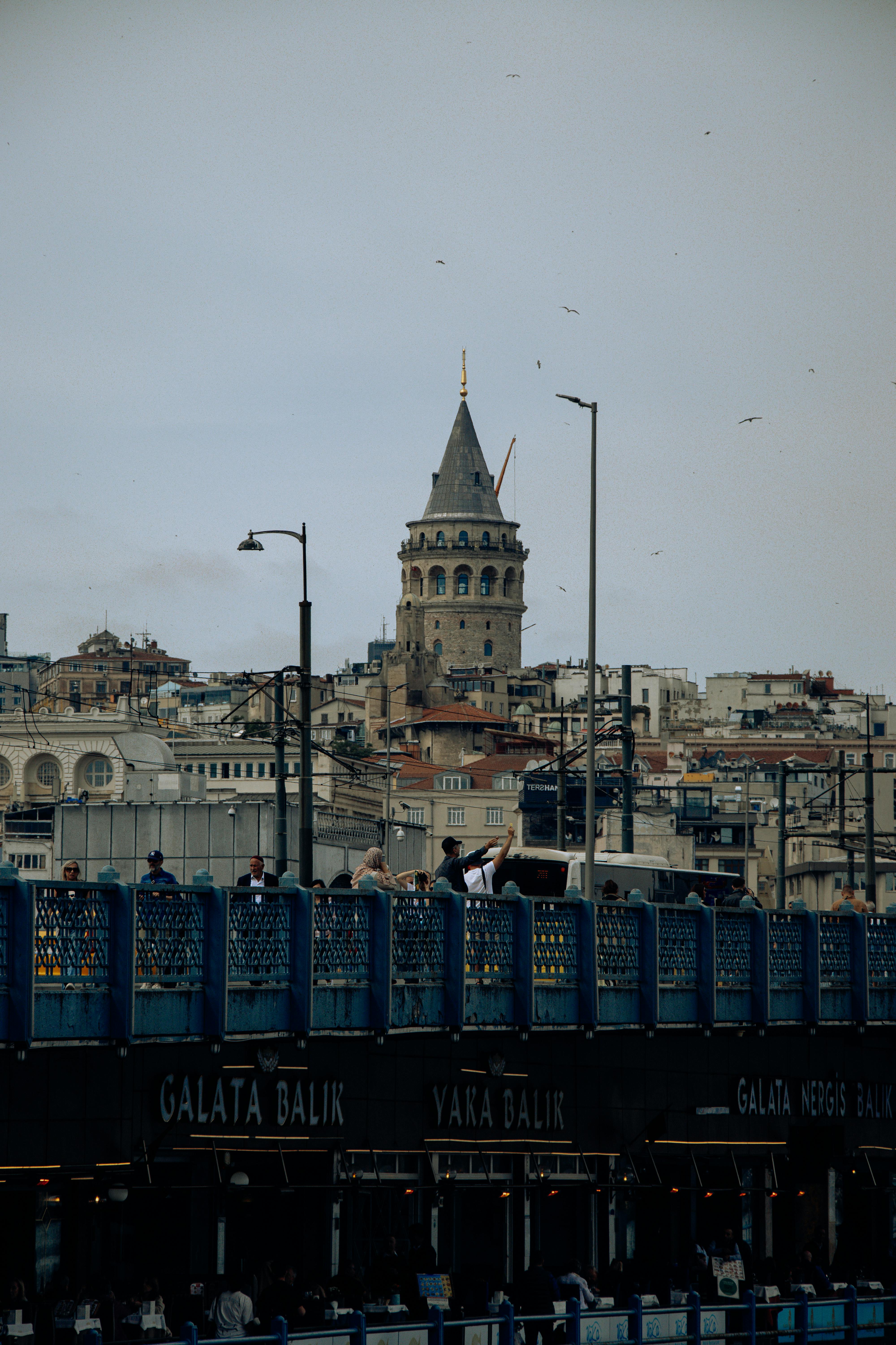 a train is traveling through a city with a clock tower