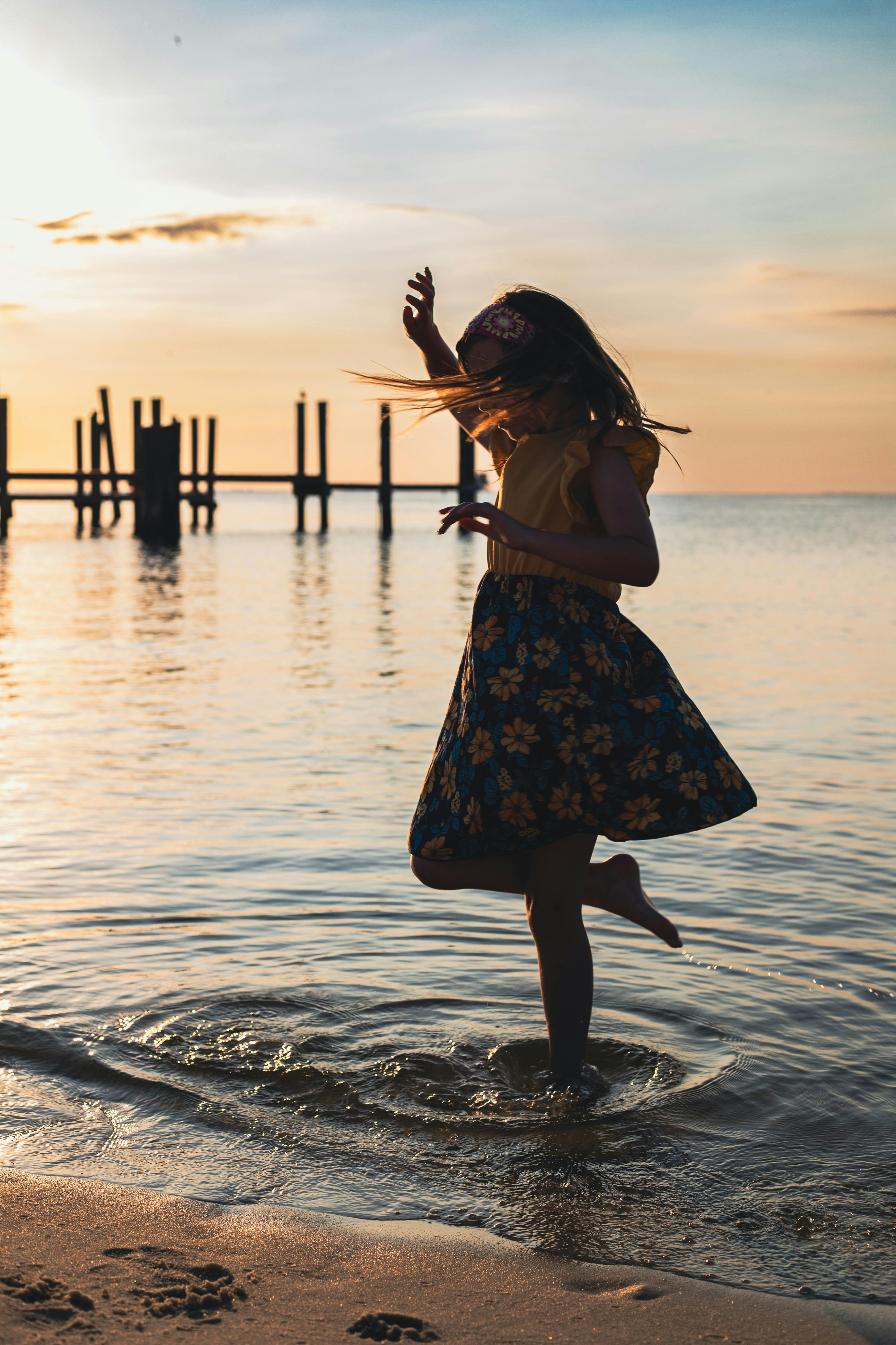 spinning in the sunset at the beach