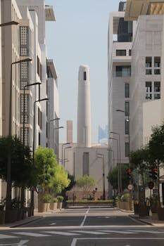 A modern urban street view showcasing contemporary architecture in downtown Doha, Qatar.