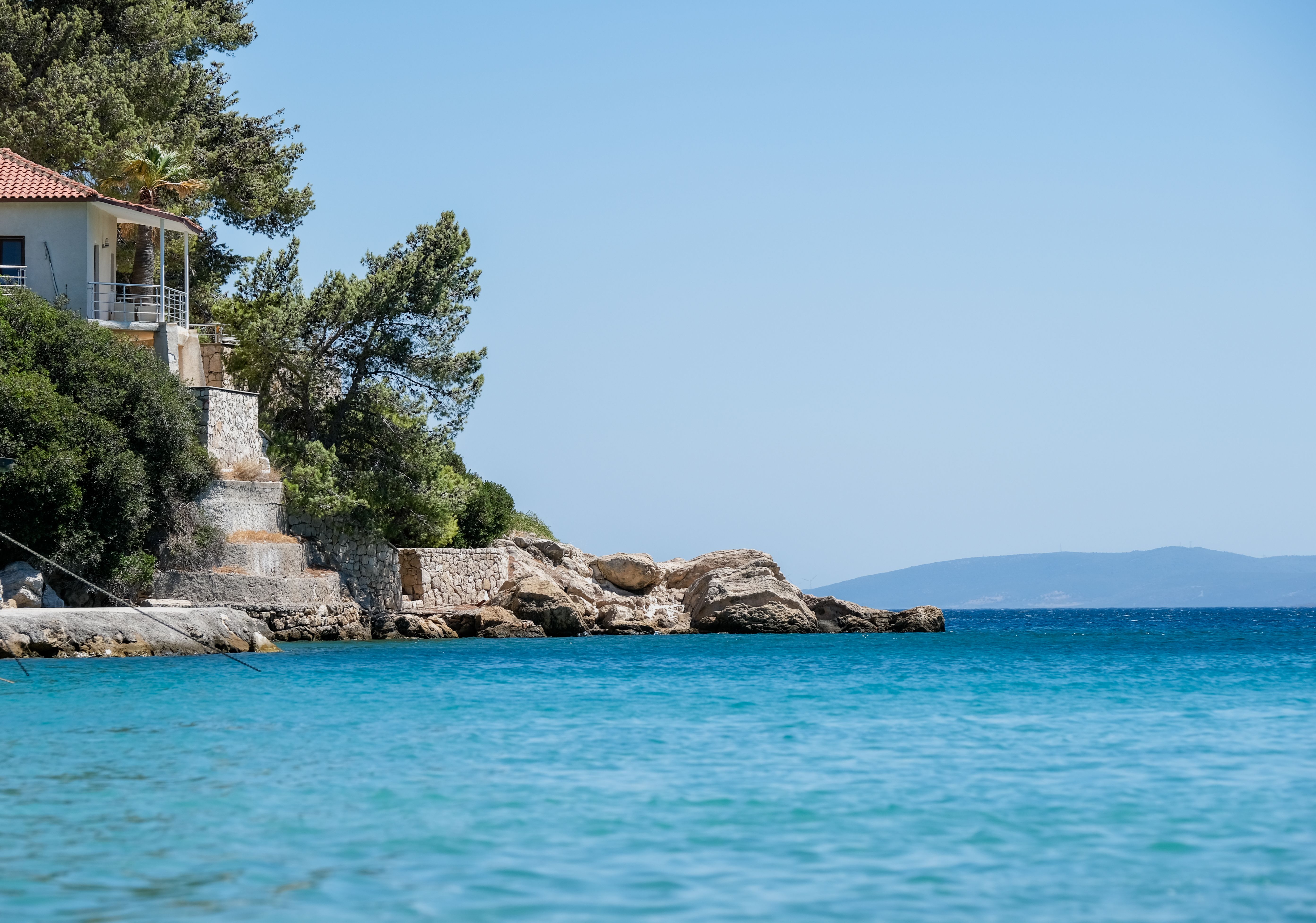Coastal House Overlooking Pristine Blue Waters · Free Stock Photo