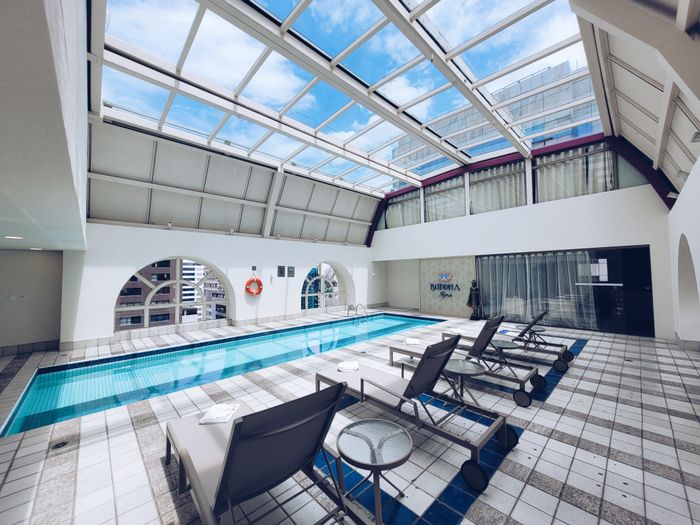 Indoor hotel pool with loungers