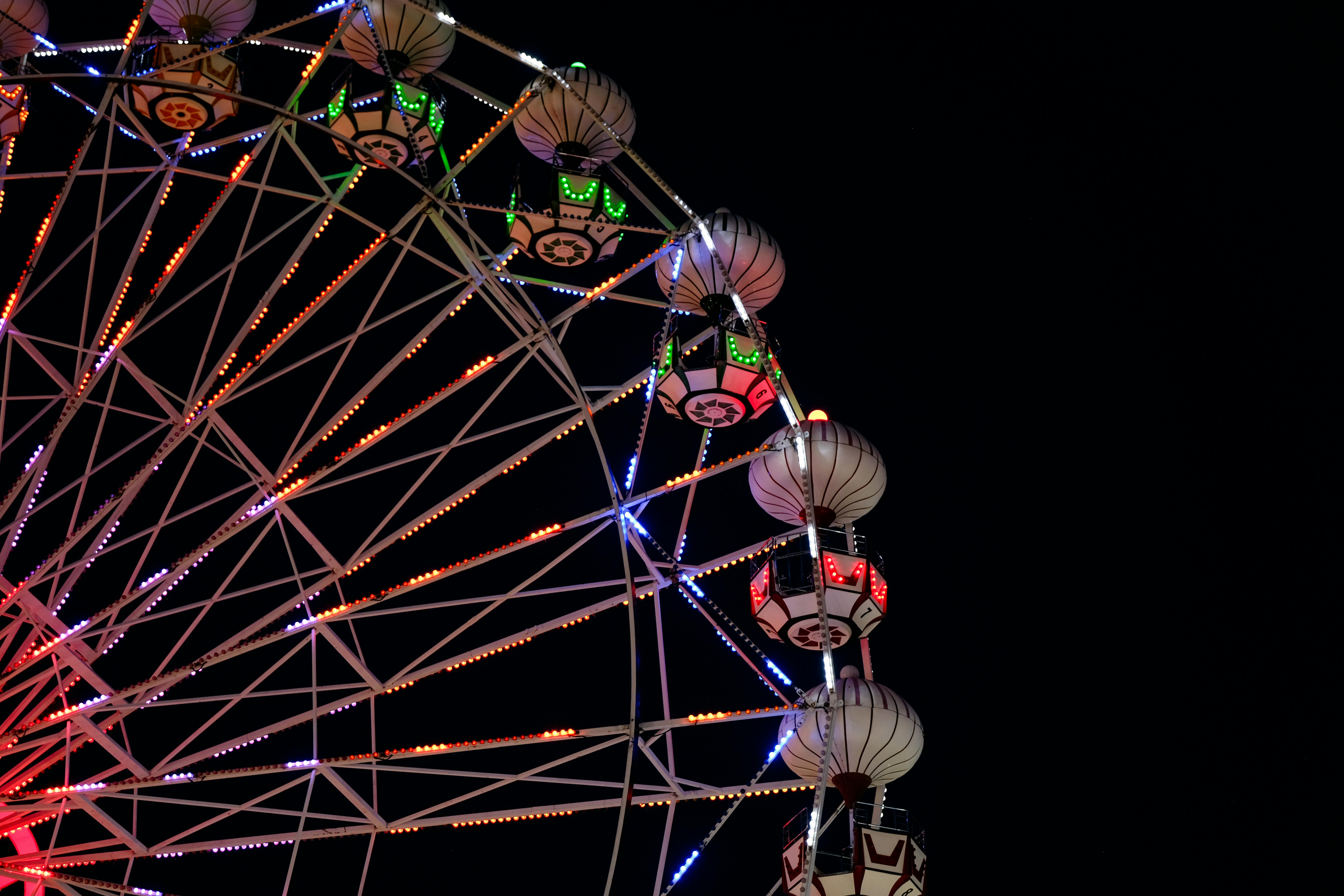 colorful ferris wheel illuminated at night