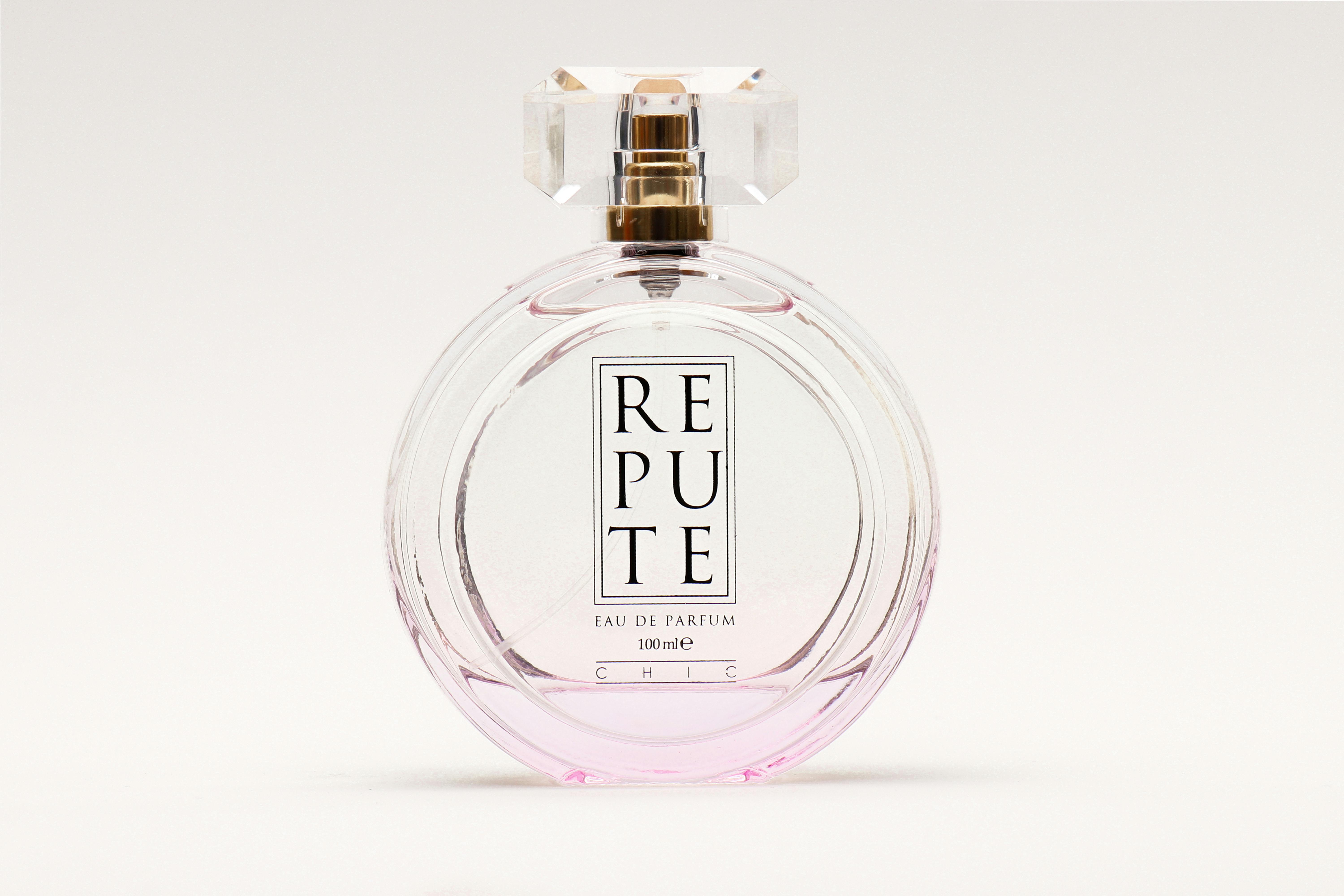 Stylish and elegant Repute perfume bottle with minimal design and sparkling glass finish.