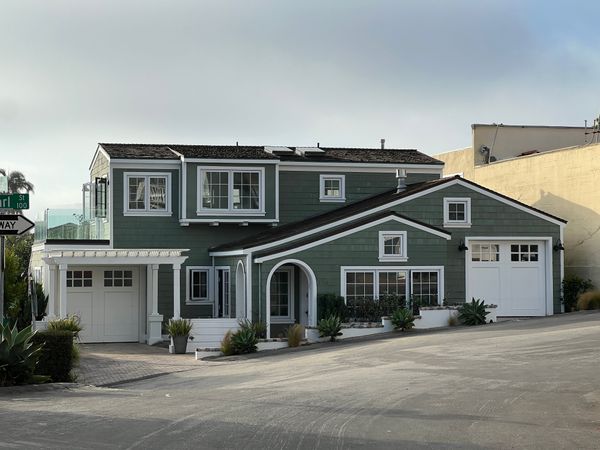 Two-storey suburban house with garages and driveway
