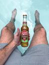 Photo of a Person Holding Bottle