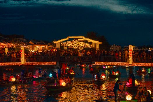 Colorful lanterns illuminate the night in Hội An during a festive evening celebration.