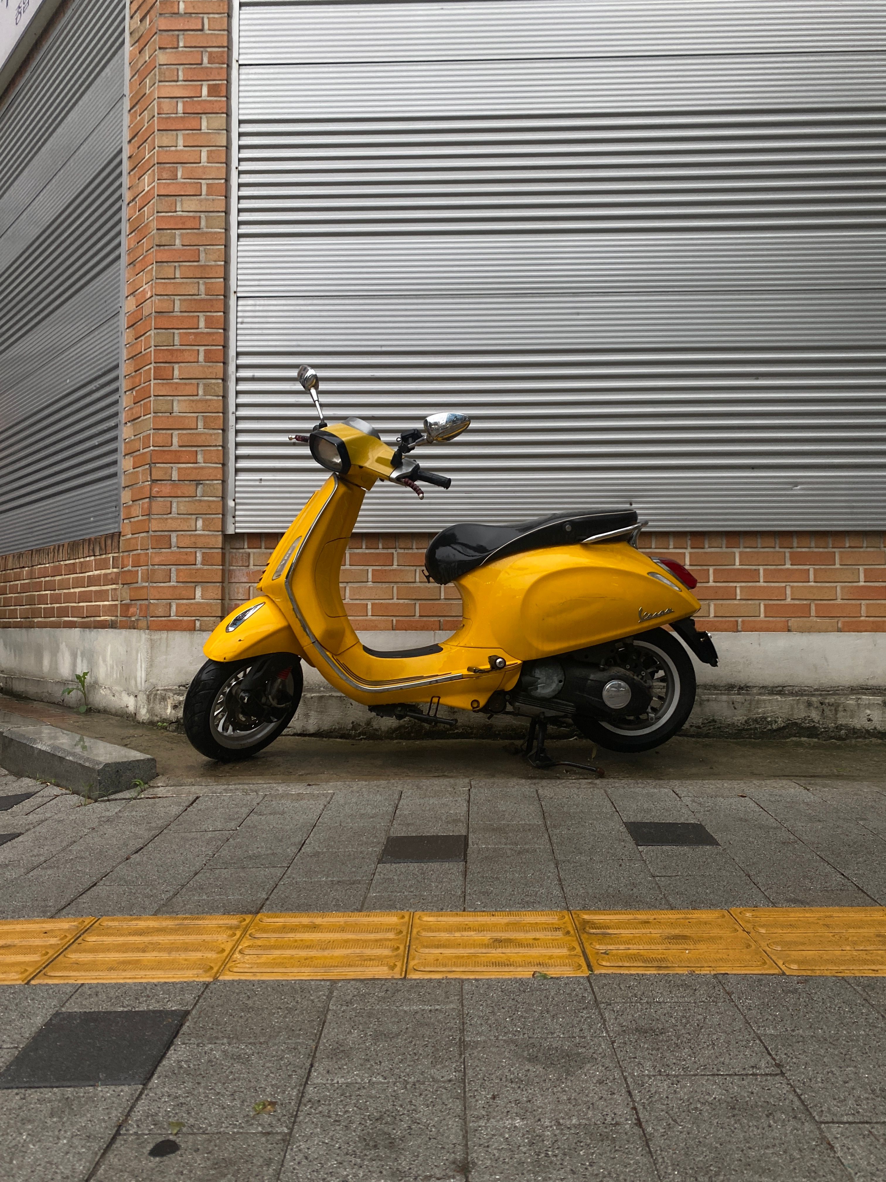 Photo of a Yellow Motor Scooter · Free Stock Photo