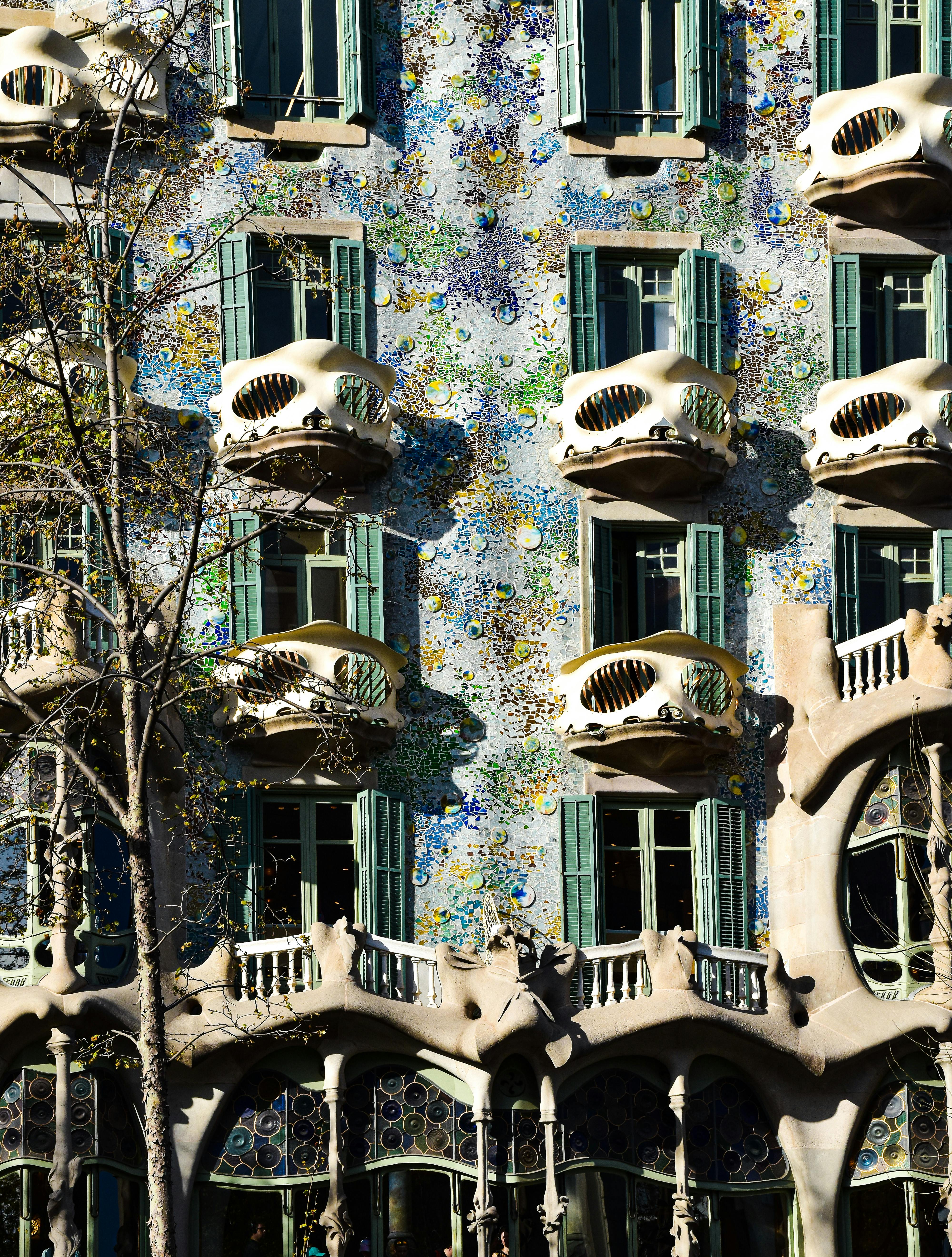 the facade of a building with many windows and balconies