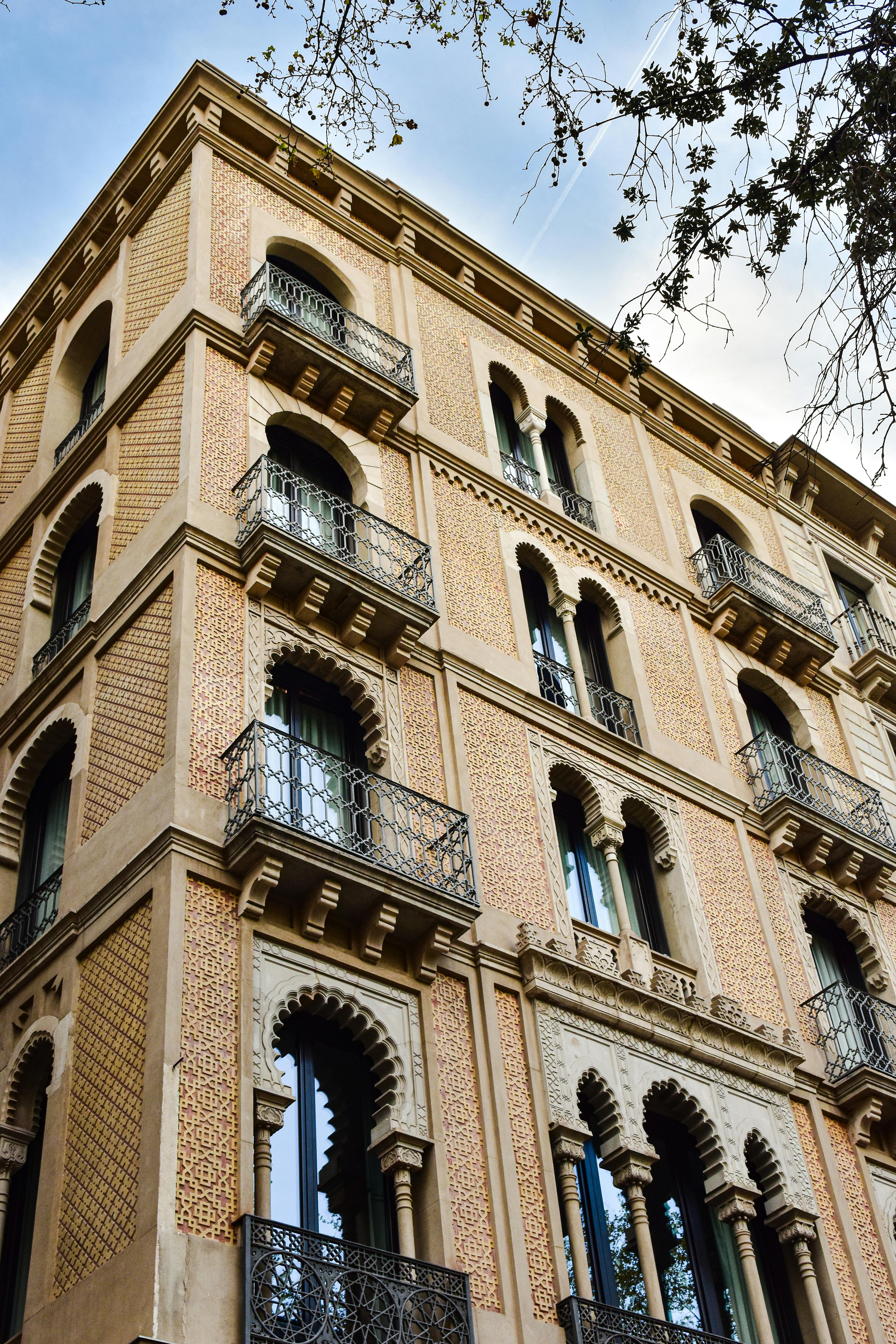 a tall building with balconies and windows