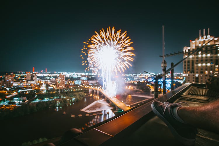 Photo Of Person Watching Fireworks During Nighttime