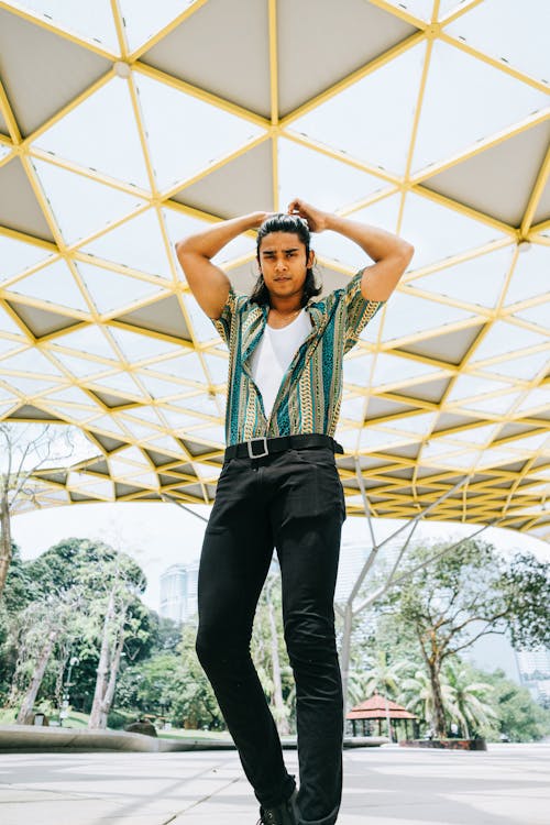 Free Low-Angle Photo of Man Standing and Holding His Hair Stock Photo