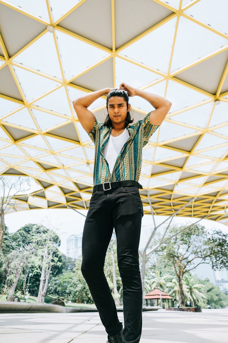 Low-Angle Photo Of Man Standing And Holding His Hair