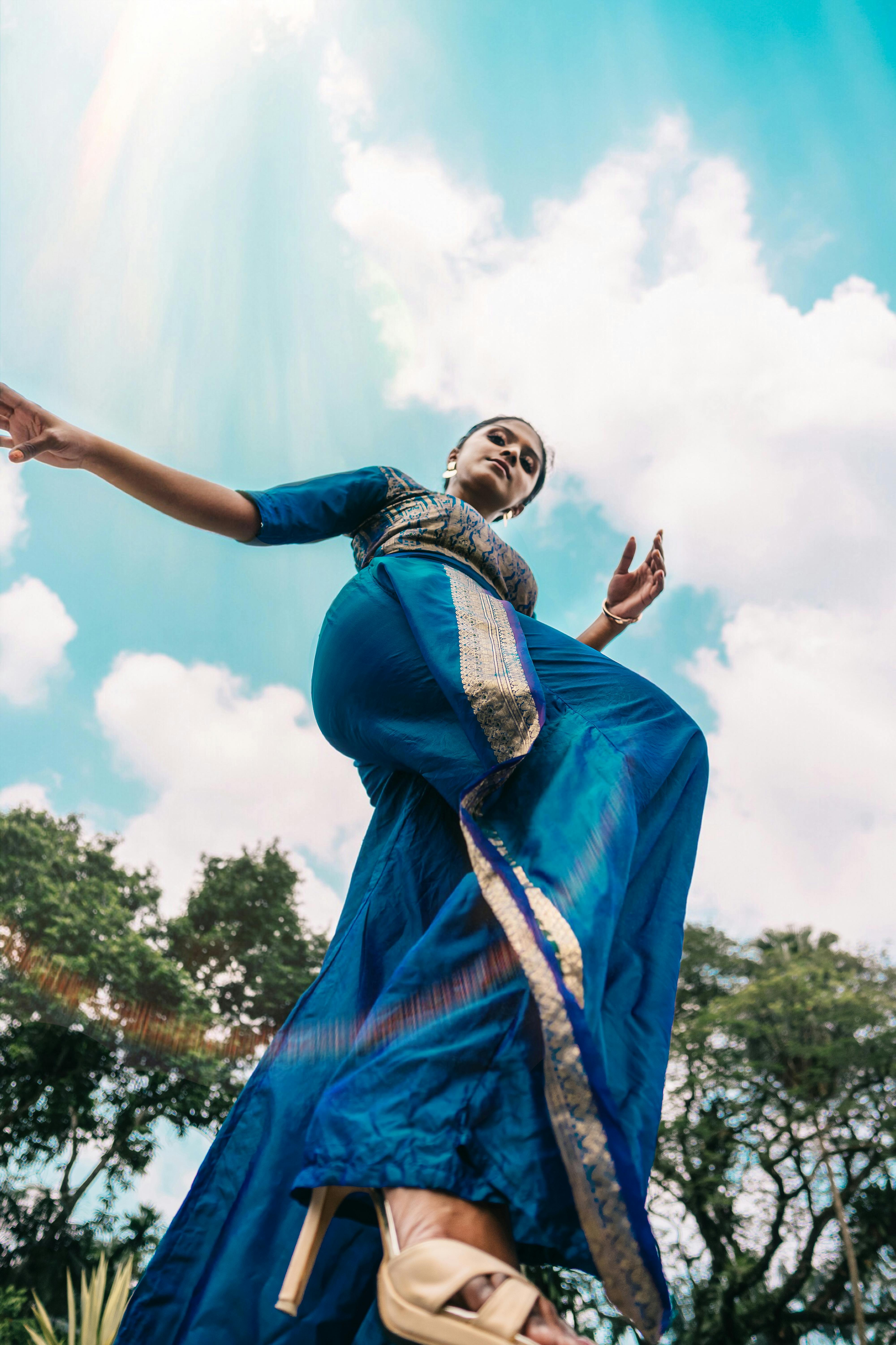 Woman Wearing Blue Sari Near Trees during Day · Free Stock Photo