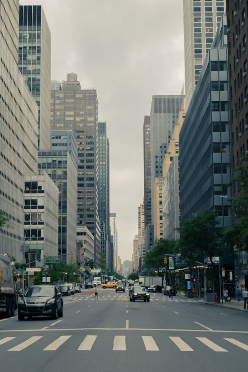 Free Urban street scene in Manhattan with tall skyscrapers and bustling traffic. Stock Photo