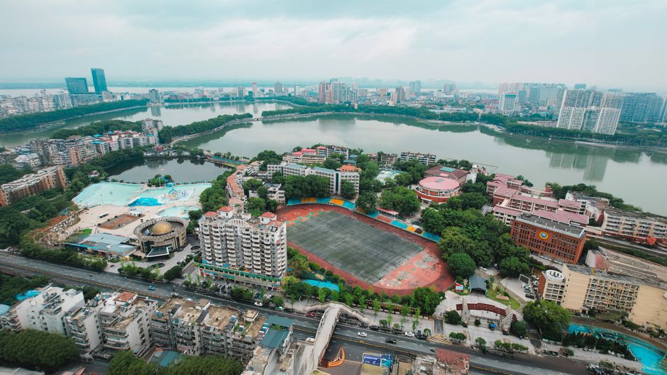 Breathtaking 1 Day Beijing Badaling Great Wall Helicopter Tour Review 2026 - Explore the vibrant cityscape of Jiujiang, showcasing its waterfront and urban structures.