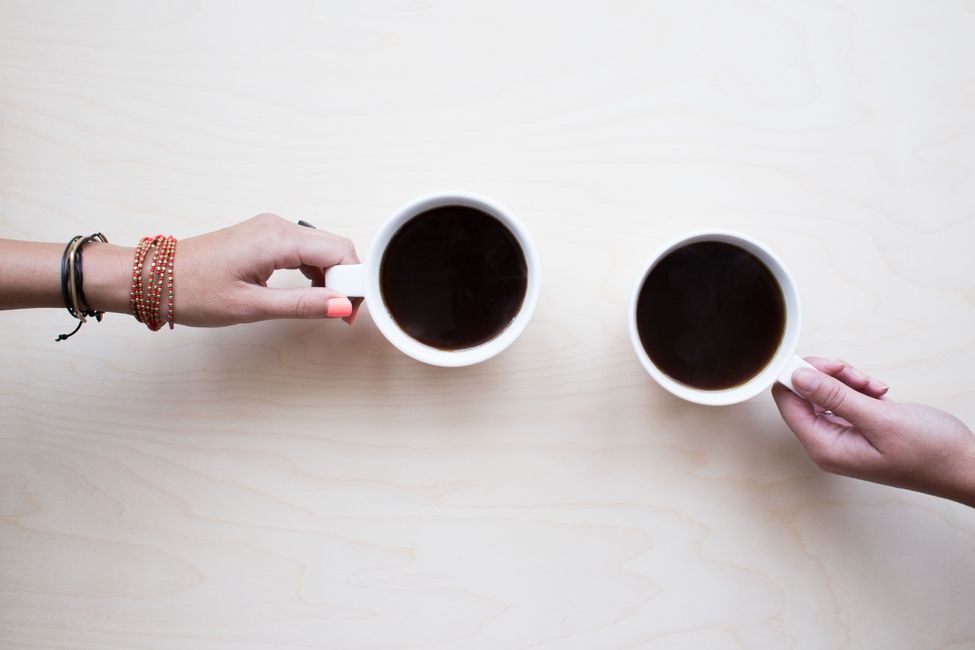 two coffee cups together