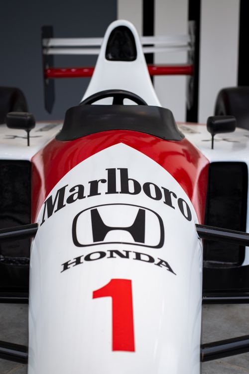 Free Close-up view of a vintage Formula 1 racing car showcasing iconic branding. Stock Photo