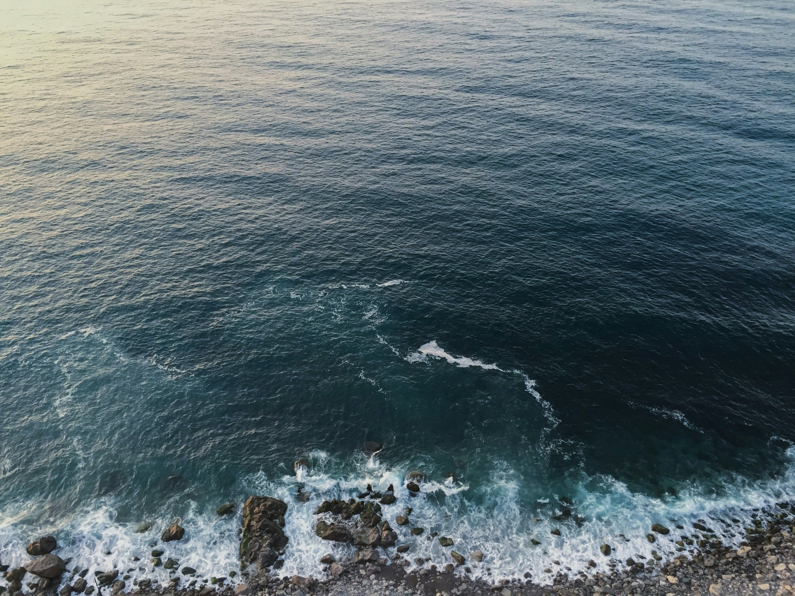 Aerial view of the ocean and rocks · Free Stock Photo