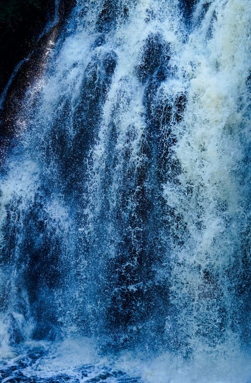 Free Stunning view of cascading turquoise waterfall with dynamic spray and texture. Stock Photo