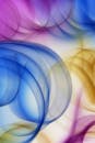 A colorful abstract background with a blue, yellow and purple swirl