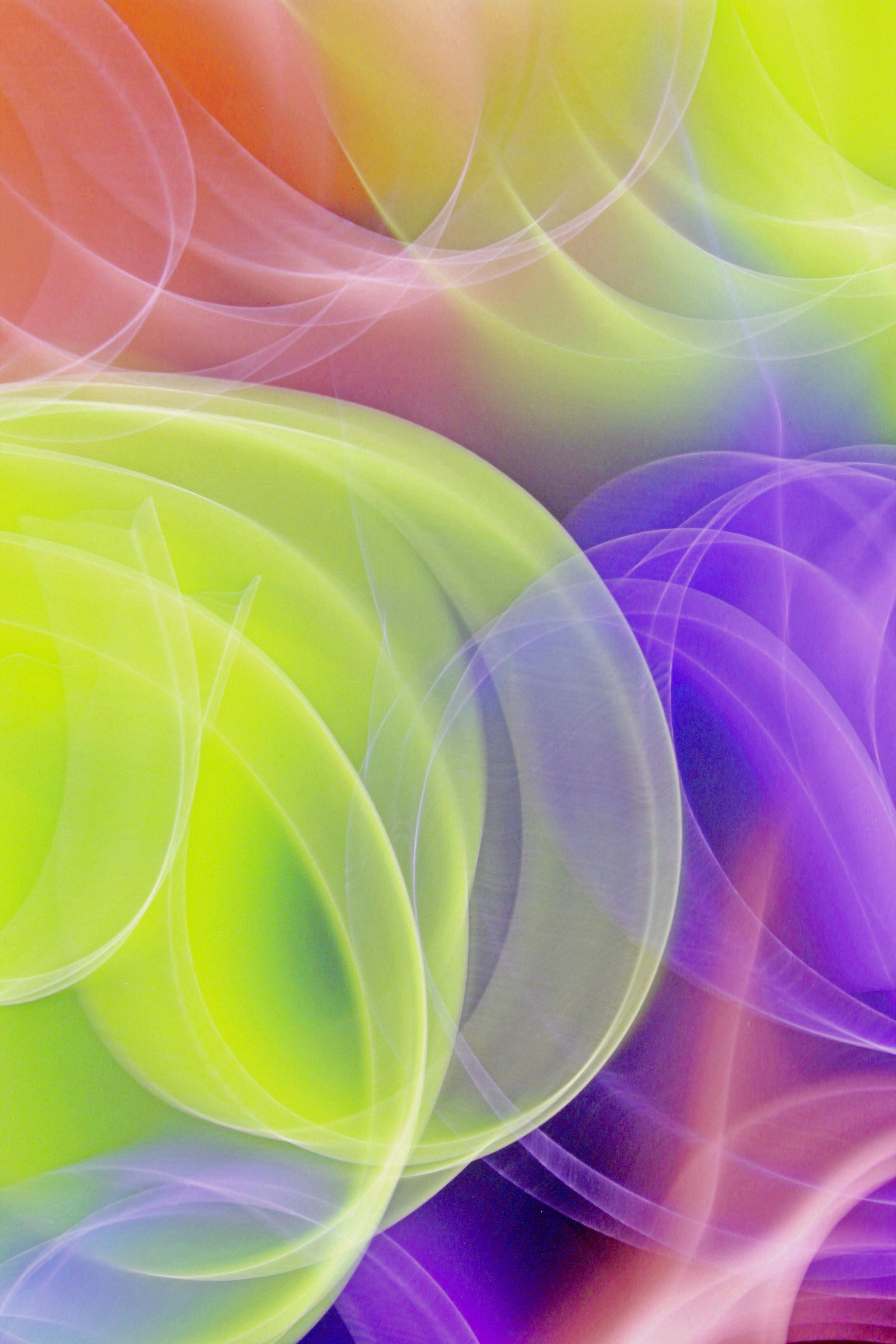 a colorful abstract background with a bright green yellow and purple swirl