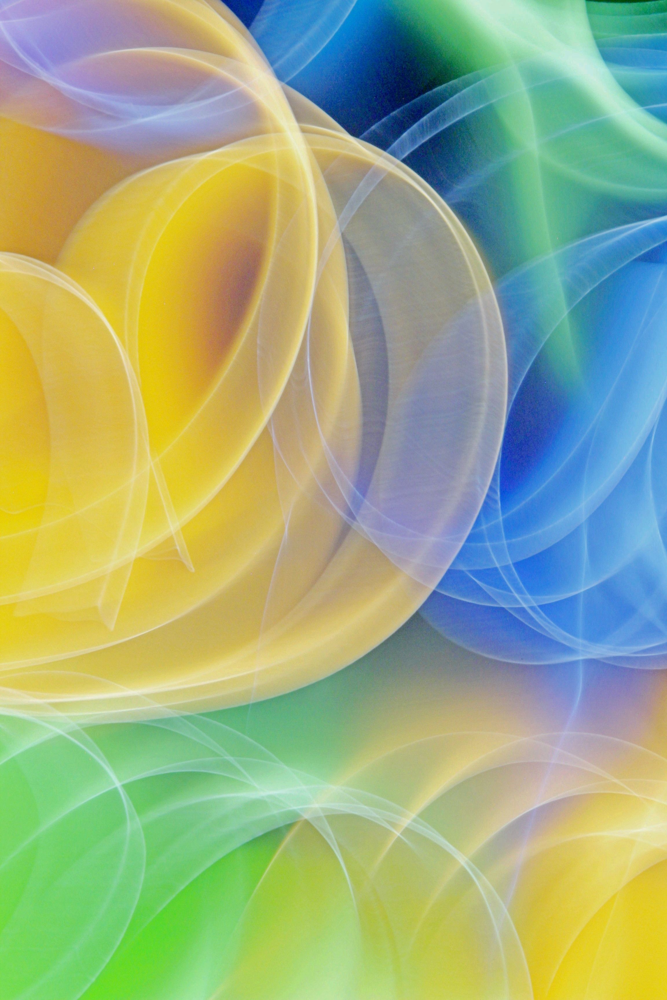 Dynamic abstract light waves with vibrant colors, creating a vivid, futuristic design.