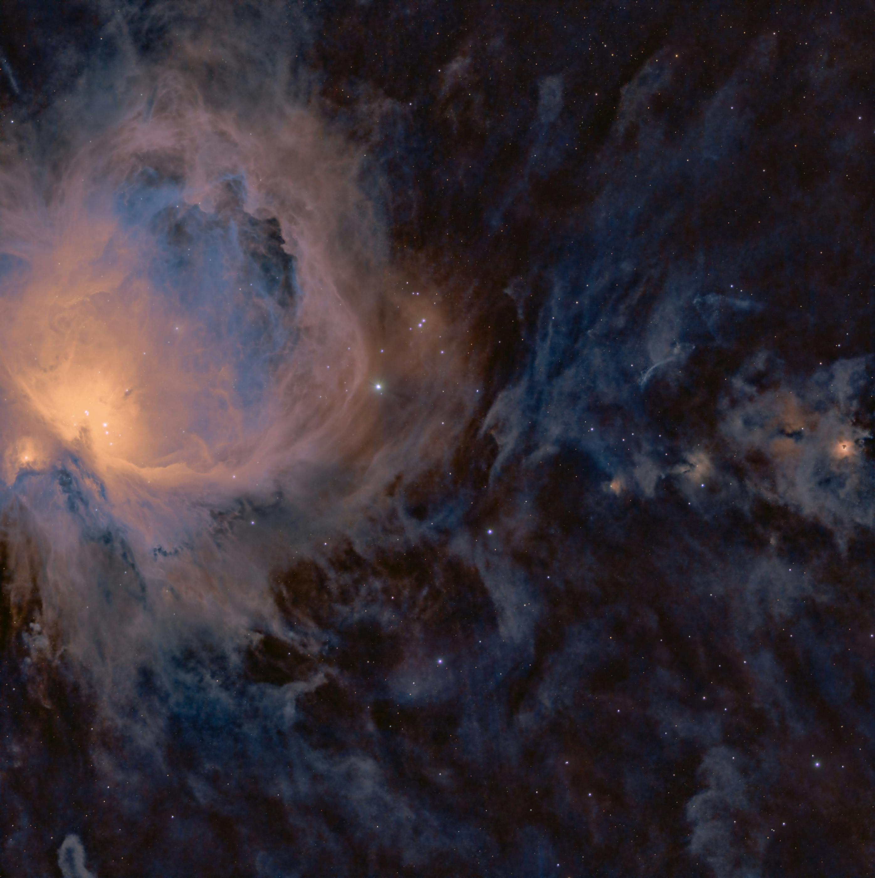 Stunning astrophotography capturing a vibrant nebula within a vast starfield in the night sky.