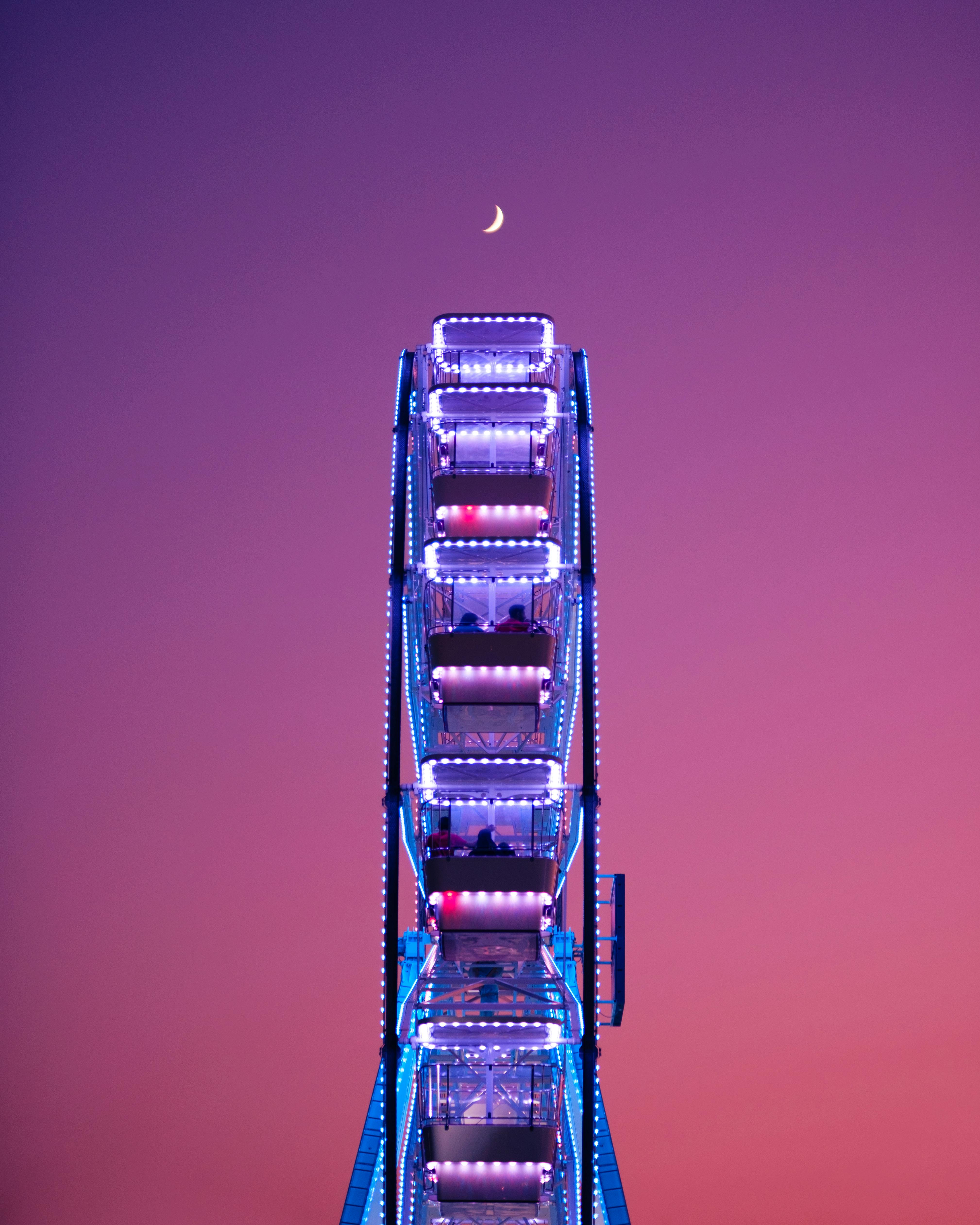 Colorful ferris wheel against a twilight sky in Tirana, Albania.