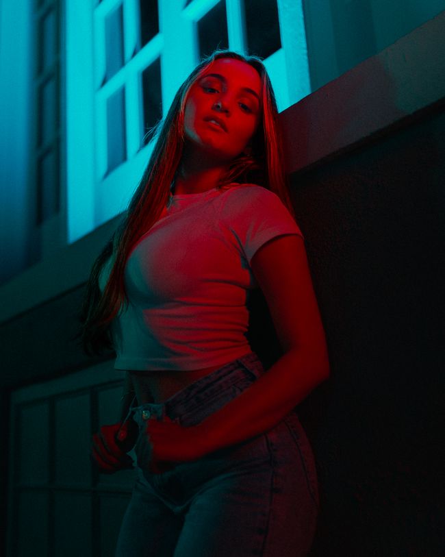 Woman in crop top and high waisted jeans for a night out