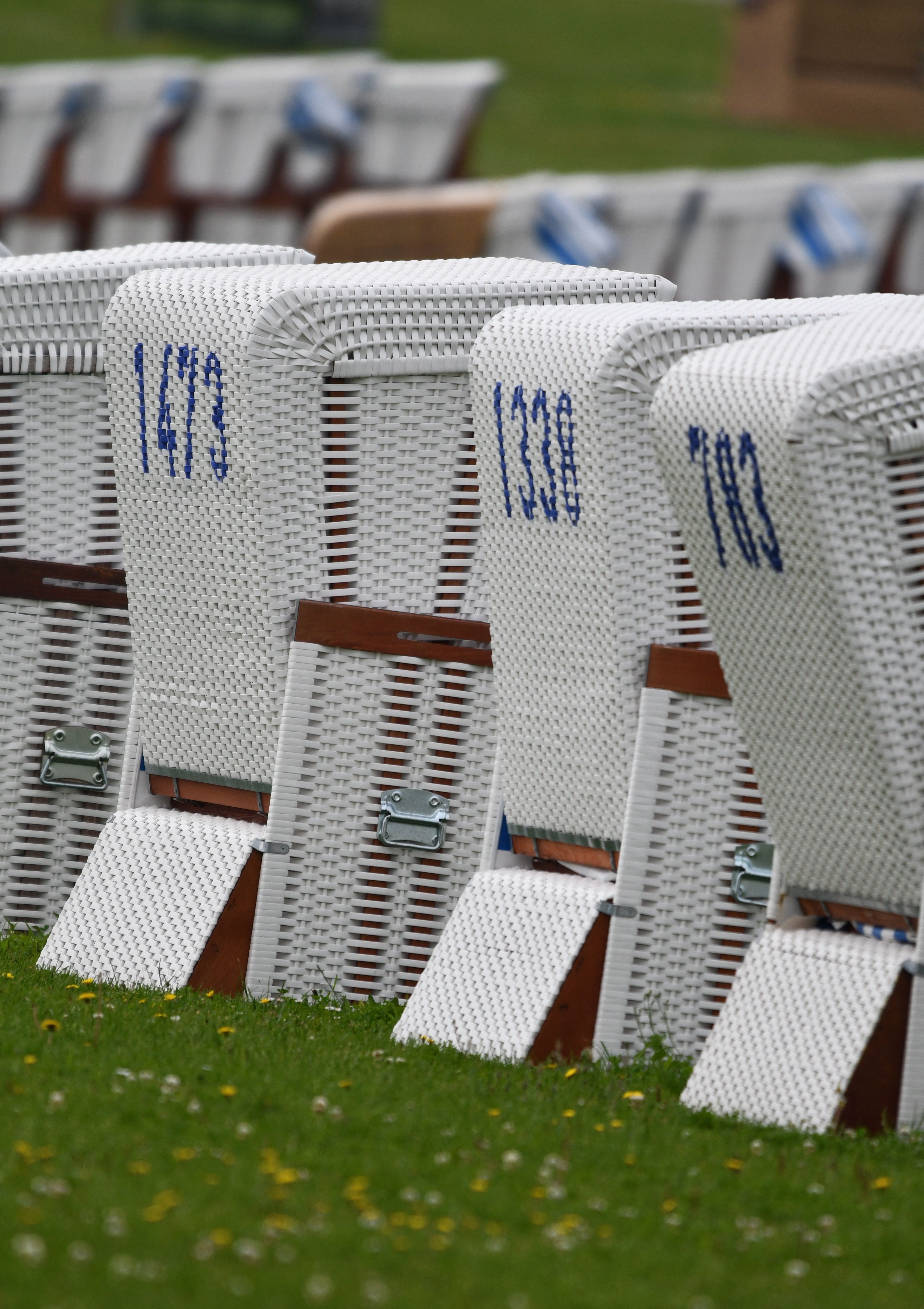A row of white chairs with numbers on them · Free Stock Photo