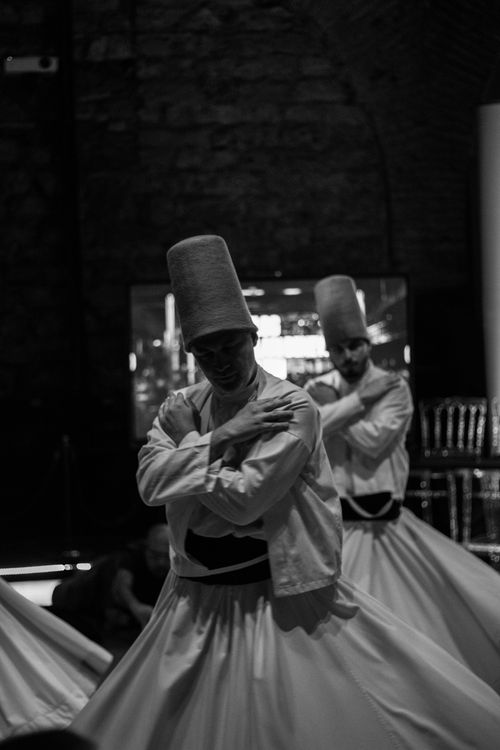 Free Black and white photo of whirling dervishes performing traditional dance in İstanbul, Turkey. Stock Photo