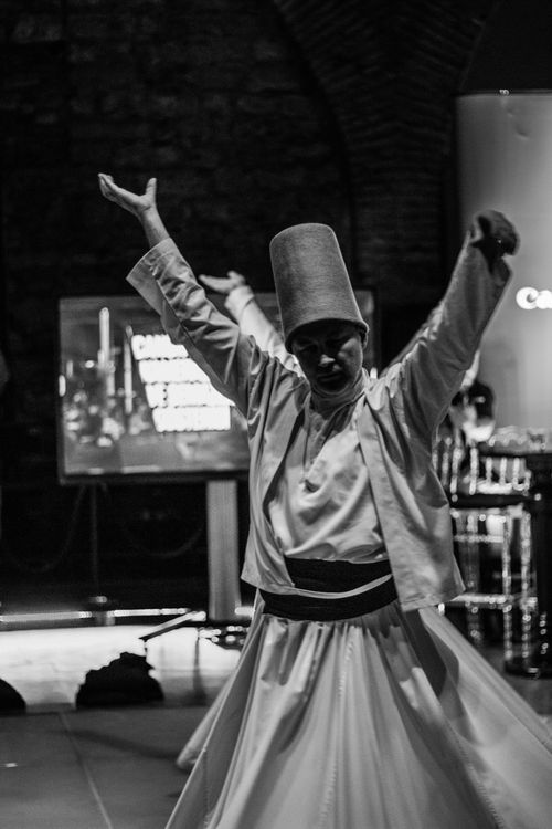 Free Black and white photo of a whirling dervish dancing in Istanbul, Turkey. Stock Photo