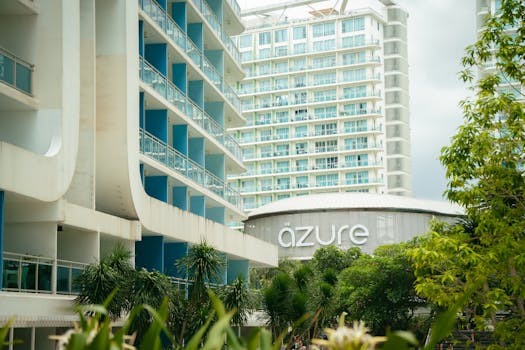 Contemporary urban architecture featuring balconies and greenery at Azure resort.