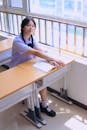 Student Sitting at a School Desk
