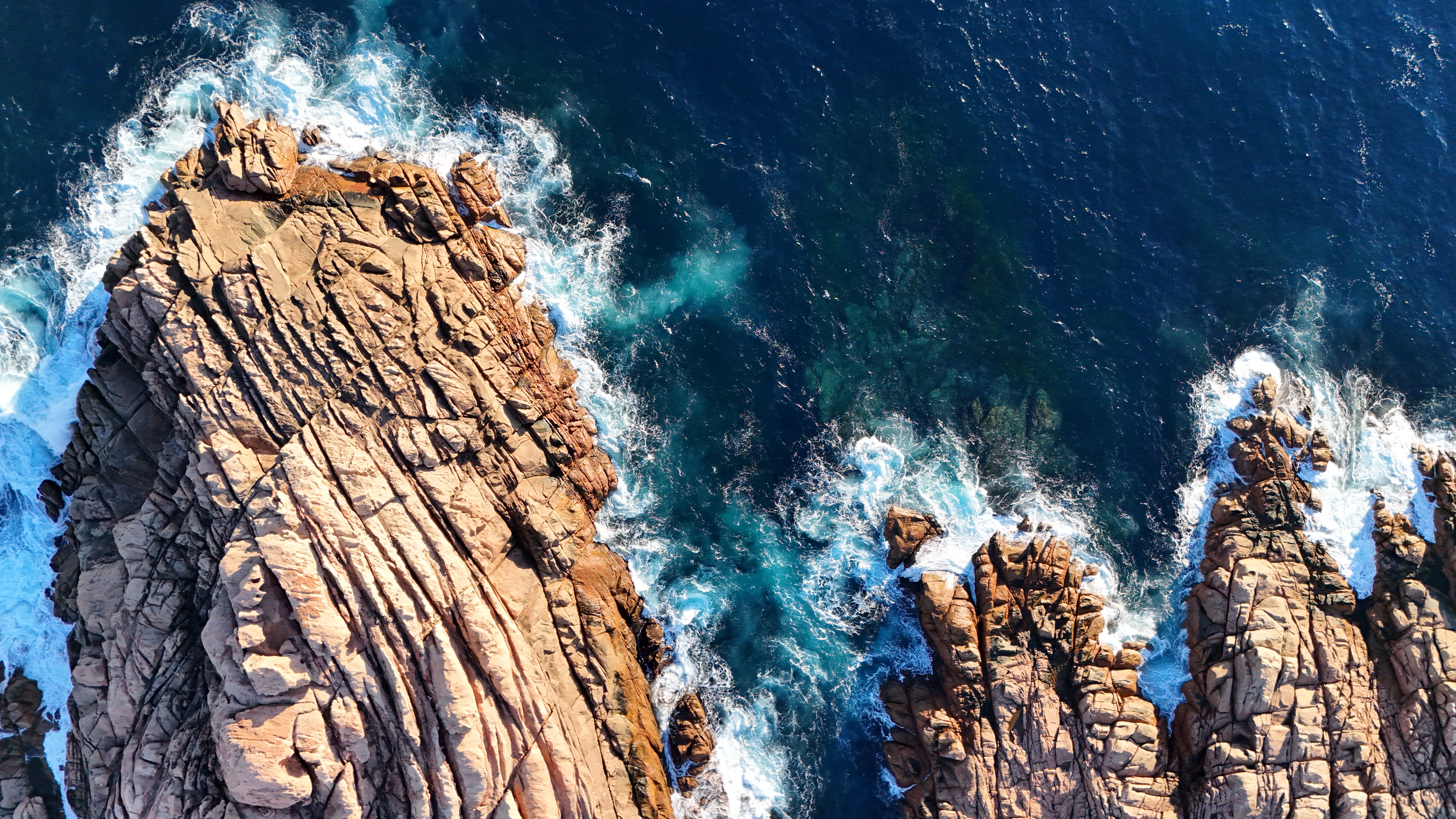 Birds Eye View of Rocks on Sea Shore · Free Stock Photo