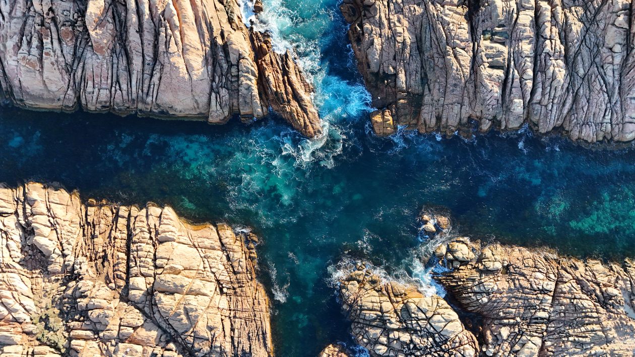 Birds Eye View of Rocks on Sea Coast · Free Stock Photo