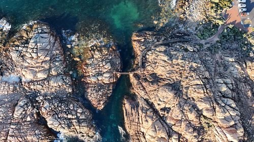 Free Drone shot capturing the rugged coast and crystal-clear waters in Western Australia. Stock Photo