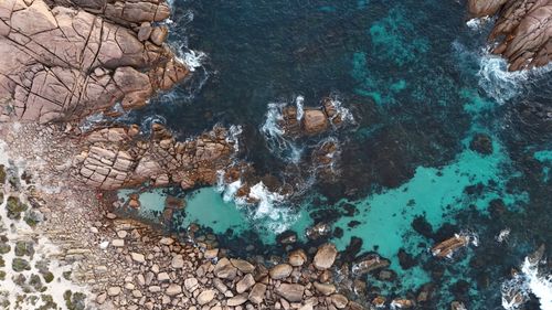 Free Stunning aerial shot capturing rocky coastline and turquoise ocean near Perth, Australia. Stock Photo