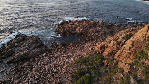 Free Breathtaking aerial view of Perth's rocky coastline during sunset, showcasing nature's raw beauty. Stock Photo