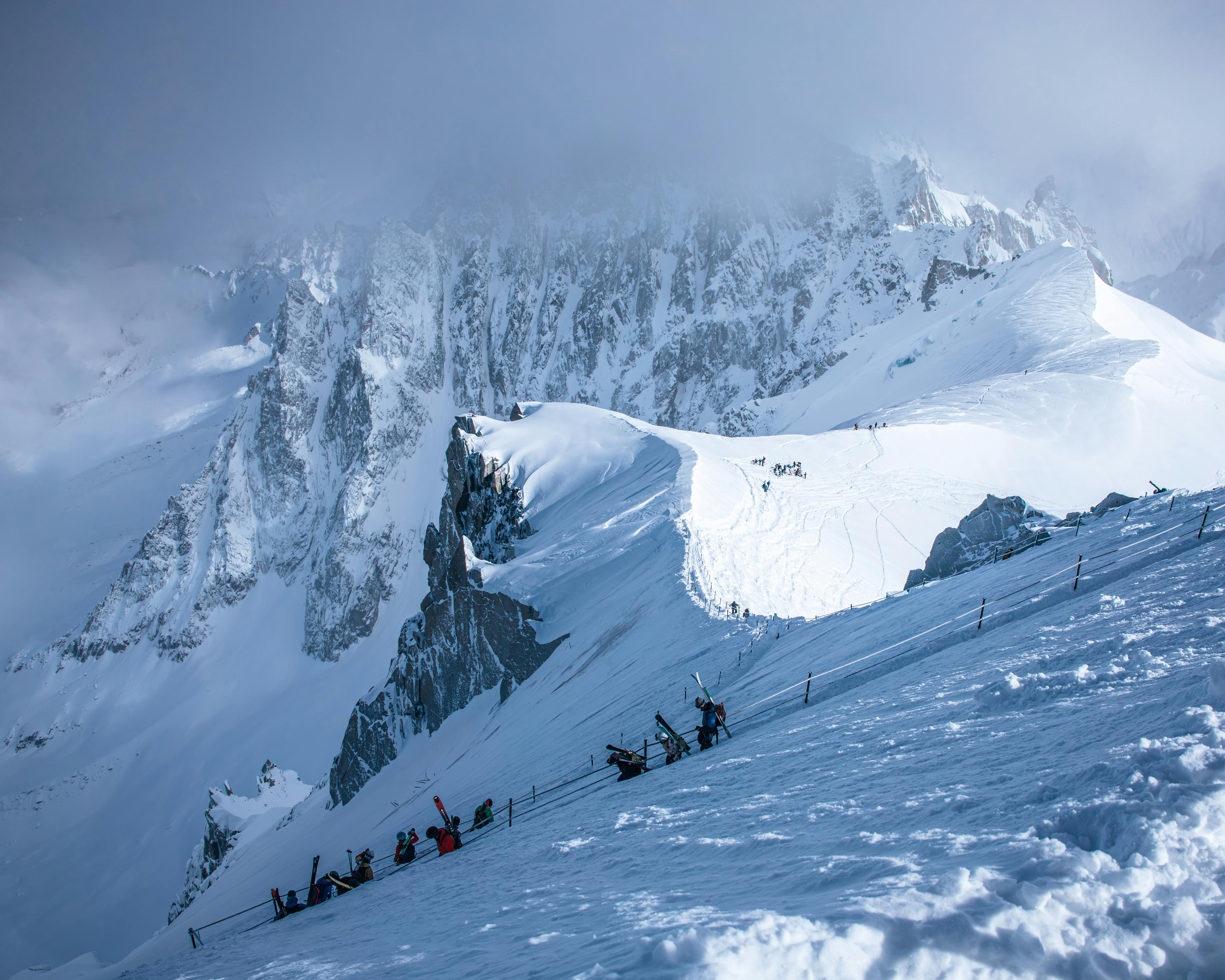 Prescription Goggle Inserts - Majestic view of skiers ascending the snowy slopes of Mont Blanc in Chamonix, France.