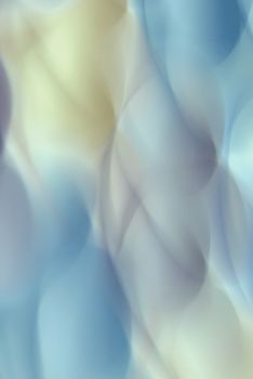 A dreamy abstract image featuring smooth, pastel-colored waves for a soft, artistic effect.